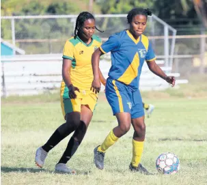  ?? LENNOX ALDRED/PHOTOGRAPH­ER ?? Vere United captain Mureka Howard (left) tries to get possession from Springers United’s Fredricka Finnikin during their JWPL encounter at the Wembley Centre of Excellence yesterday.