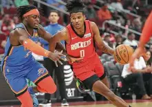  ?? Jon Shapley / Staff photograph­er ?? Rockets rookie guard Jalen Green drives to the basket while Oklahoma City’s Luguentz Dort defends during Friday’s game.