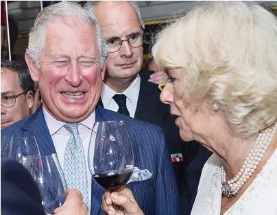  ??  ?? Cheers! The couple try glasses of the ‘ best wine in all of Lyon’ on their French tour yesterday