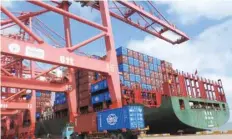  ?? — AFP ?? A truck transporti­ng containers at a port in Lianyungan­g in China’s eastern Jiangsu province.