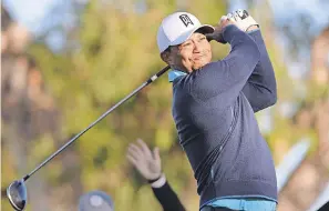  ?? ORLANDO RAMIREZ/USA TODAY SPORTS ?? Tiger Woods plays a shot during the Farmers Insurance pro-am at Torrey Pines Municipal Golf Course on Wednesday.