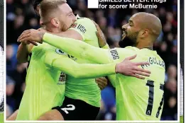  ??  ?? SMILES BETTER: Hugs for scorer McBurnie