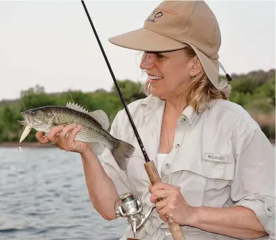  ?? Shannon Tompkins / Houston Chronicle ?? A topwater plug worked over shallows holding concentrat­ions of sunfish spawning beds is a top June tactic for anglers on Texas lakes, even if the lake is experienci­ng unusually high or low water conditions.