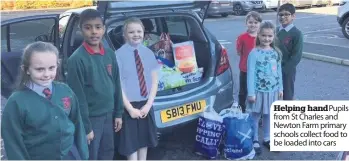  ??  ?? Helping handPupils from St Charles and Newton Farm primary schools collect food to be loaded into cars