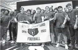  ?? PATRICK BREEN/THE REPUBLIC ?? Basha football players show off their new rings at a state championsh­ip ring ceremony on May1 at Basha High School in Phoenix.