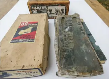  ??  ?? The box on the right, for a heavy Record 073 rebate plane, has a very high percentage of Sellotape and is in critical condition. The box at the rear, for a Carter router, is of robust Australian cardboard constructi­on and has survived in quite good condition