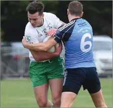  ??  ?? Shane Dowling (St Patrick’s) retains possession under pressure from Carl M ullen of St Colmcille’s during their SFC clash.