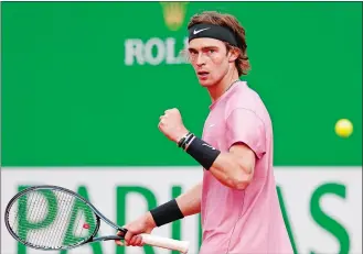  ?? JEAN-FRANCOIS BADIAS/AP PHOTO ?? Andrey Rublev reacts after scoring a point against Rafael Nadal during their quarterfin­al match at the Monte Carlo Masters on Friday in Monaco. Rublev won 6-2, 4-6, 6-2.