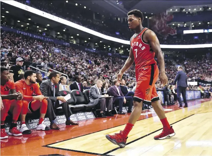  ?? FRANK GUNN/THE CANADIAN PRESS ?? Raptors guard Kyle Lowry walks off the court after getting ejected following back-to-back technical fouls Sunday against the Washington Wizards.