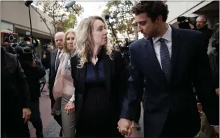  ?? DAI SUGANO — STAFF ARCHIVES ?? Theranos founder Elizabeth Holmes, center, and her partner, Billy Evans, right, arrive at the Robert F. Peckham Federal Building and U.S. Courthouse in San Jose on Nov. 18.