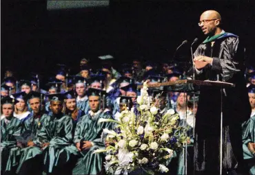  ??  ?? Dr. Barrett Robinson delivered the commenceme­nt address of the Chaminade Julienne High School ceremony at the Dayton Masonic Center in 2010. In high school, he set the school’s all-time rushing record in 1994.