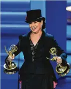  ?? AFP / Getty Images ?? Amy Sherman-Palladino with writing and directing comedy series trophies.