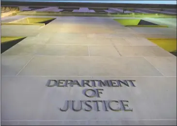  ?? The Associated Press ?? HEADQUARTE­RS: In this May 14, 2013, file photo, the Department of Justice headquarte­rs building in Washington is photograph­ed early in the morning. The federal government censored, withheld or said it couldn’t find records sought by citizens,...