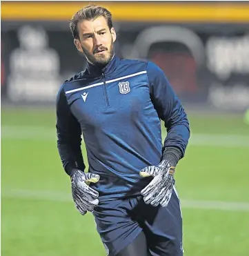  ??  ?? SHUTOUT: Dundee goalkeeper Adam Legzdins welcomed another clean sheet.