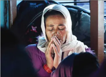  ?? PRAKASH MATHEMA/AFP ?? A Nepali Christian takes part in a church service in Lapa village in Dhading, some 100 kilometres northwest of Kathmandu, on October 8.