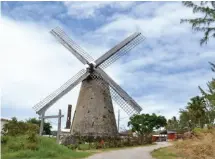  ??  ?? OPPOSITE TOP: Try paddleboar­d yoga on your Bajan holiday. LEFT: Open for special events, St. Nicholas Abbey creates rum of “exceptiona­l quality and provenance.” ABOVE: The Morgan Lewis Windmill is the only operationa­l sugar mill left on the island. Barbados Tourism Authority
