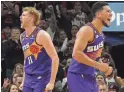  ?? PATRICK BREEN/THE REPUBLIC ?? Suns’ Jock Landale (11) and Devin Booker (1) react after an offensive rebound.