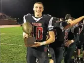  ?? JEFF STOVER - DFM ?? Boyertown’s Jerry Kapp carries the Eastern Conference championsh­ip trophy after the Bears’ win Friday.
