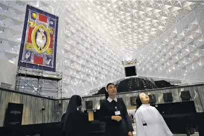  ?? MARCIO JOSE SANCHEZ/ASSOCIATED PRESS ?? Nuns get a first look Monday at the newly renovated Christ Cathedral in Garden Grove, Calif. The 88,000-square-foot Catholic church has undergone a $77 million renovation.