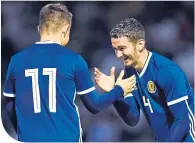  ??  ?? Jordan Holsgrove (right) congratula­tes Glenn Middleton on his goal against San Marino