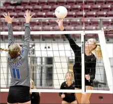  ?? Bud Sullins/Special to the Siloam Sunday ?? Siloam Springs senior Ellie Lampton tips the ball over Rogers blocker Gracie Carr during Thursday’s match inside Panther Activity Center. Lampton led Siloam Springs with 13 kills and 12 digs as the Lady Panthers swept the Lady Mounties 3-0.