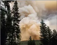  ?? AP PHOTO/NOAH BERGER ?? The Dixie Fire burns in Lassen National Forest, Calif., near Jonesville on Monday, July 26, 2021.