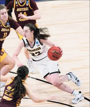  ?? Eric Gay / Associated Press ?? Iowa guard Caitlin Clark (22) drives against Central Michigan in the first round of the NCAA tournament on Sunday.