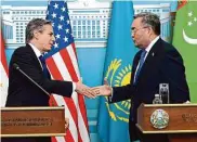  ?? Olivier Douliery/Associated Press ?? Secretary of State Antony Blinken, left, greets Kazakhstan’s Foreign Minister Mukhtar Tileuberdi.