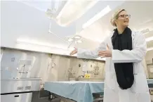  ?? IAN KUCERAK ?? Mikayla Frost, autopsy suite team leader, gives a tour of the area inside the newly renovated Office of the Chief Medical Examiner in Edmonton on Wednesday.