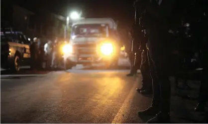  ?? Photograph: Ivan Villanueva/EPA ?? Police guard the place where 19 people were murdered, in the community of La Tinaja, in the municipali­ty of Zinapécuar­o, state of Michoacán, Mexico.