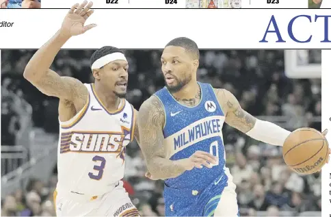  ?? PATRICK MCDERMOTT/AGENCE FRANCE-PRESSE ?? DAMIAN Lillard (right) drops 31 points and 16 assists to lead the Milwaukee Bucks to a 140-129 win over Bradley Beal and the Phoenix Suns in the NBA regular season.