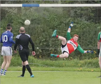  ?? Picture: Paul Connor ?? St Mary’s goalkeeper Adam Byrne goes the wrong way as Slane’s Alan Harding scores a penalty during Sunday’s Division 4 FL game.