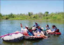  ?? Buy these photos at YumaSun.com PHOTOS BY AMY CRAWFORD/YUMA SUN ?? STUDENTS FROM WELLTON ELEMENTARY SCHOOL’S Terra House set off for a floatdown on the Colorado River on Monday afternoon after winning the school’s first “house championsh­ip.” The house, which was the underdog until about the third quarter, said teacher Maria Roth, won a trip into Yuma for their teamwork in various tasks. The house was treated to a movie, a picnic lunch at Gateway Park and were to have another dinner feast at West Wetlands Park after disembarki­ng from the river trip.