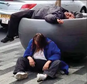  ??  ?? Going nowhere: A Spice user frozen to the spot as shocked Manchester commuters pass by. Above and below: Comatose addicts in Wrexham pictured by bus driver Gavin Rodda