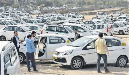  ?? SANJEEV VERMA/HT PHOTO ?? n Unlike in India, where a Delhi high court order described the relationsh­ip between drivers and companies as ‘purely contractua­l’, which limits benefits to them, courts in the US and UK have sided with drivers, ruling that Uber must consider them as...