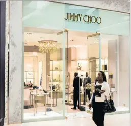  ?? PHOTO: BLOOMBERG ?? Luxury shoemaker Jimmy Choo’s shares shot up at the news of the deal.