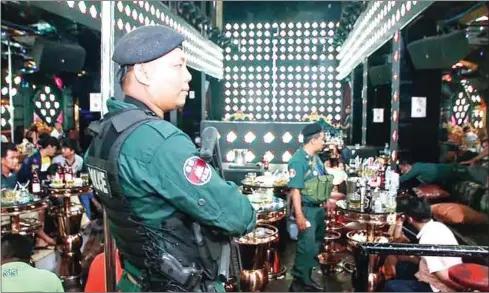  ?? SUPPLIED ?? Police arrest some 400 people, including around 130 foreigners, at the Luxurious nightclub in Phnom Penh on Saturday.