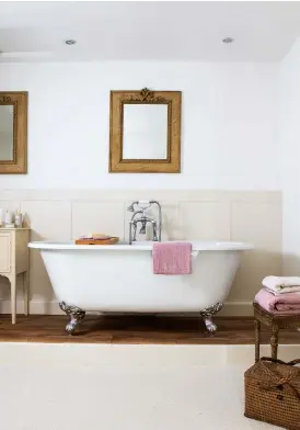  ??  ?? Above left: The freestandi­ng bath makes best use of the space in the family bathroom. The bath is from Watermark Plumbing Supplies and Angela added a cupboard which was a car-boot find