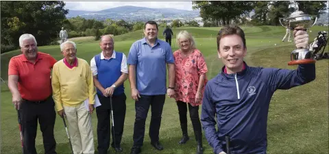  ??  ?? Michael Lernihan, Syl Fox, Gerry Lyster, Reggie Corrigan, Suzanne Cox and Ken Doherty lifting the Reggie Corrigan Cup.