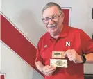  ?? ERIC OLSON/AP ?? John Fey, holding ticket stubs from the 1971 Game of the Century between OU and Nebraska and the 1984 Orange Bowl, has seen Nebraska football do lots of amazing things over the years.