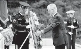  ?? Chip Somodevill­a Getty Images ?? AUSTRALIAN Prime Minister Malcolm Turnbull’s U.S. visit includes a stop at the Tomb of the Unknowns at Arlington National Cemetery in Virginia.