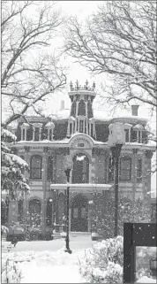  ??  ?? The Nesbitt House in Cowansvill­e looked like it was captured inside a giant snow globe!