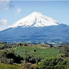  ??  ?? Changing the mountain’s name to Taranaki created a furore at the time.