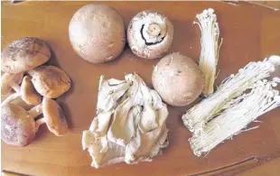  ?? CONTRIBUTE­D ?? Here’s a variety of mushrooms, including clockwise from centre top, portobello, enoki, oyster and cremini.