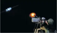  ?? REUTERS ?? A UKRAINIAN serviceman from an anti-drone mobile air defence unit fires a machine gun at a Russian kamikaze drone, amid Russia’s attack on Ukraine, in Kherson region, on Friday.
|