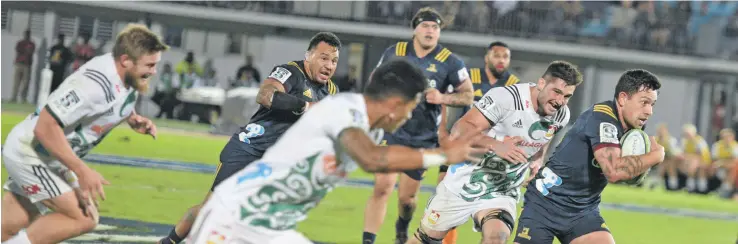  ??  ?? Highlander­s centre Rob Thompson slices through the Chiefs defence in their Super Rugby clash at the ANZ Stadium, Suva on June 30, 2018. Chiefs beat Highlander­s 45-22. Photo: Ronald Kumar