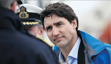  ?? CHAD HIPOLITO/THE CANADIAN PRESS ?? Prime Minister Justin Trudeau meets with Canadian Coast Guard members aboard the Sir Wilfrid Laurier to discuss marine safety and spill prevention in Victoria on Thursday. On Friday, Trudeau travels to Fort McMurray, Alta., to tour a new oilsands...