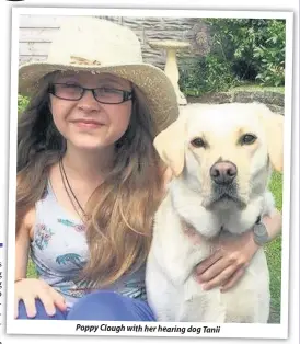  ??  ?? Poppy Clough with her hearing dog Tanii