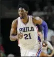  ?? JESSICA HILL — THE ASSOCIATED PRESS ?? Philadelph­ia 76ers’ Joel Embiid will be out indefinite­ly with a swollen knee.