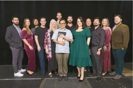  ?? ERIC JOANNES ?? Michael Ching, center, composer and conductor, with the cast of Florida Grand Opera’s “Gianni Schicchi” and “Buoso’s Ghost.”